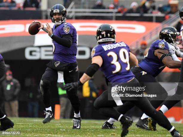 Quarterback Joe Flacco of the Baltimore Ravens throws a pass to running back Danny Woodhead in the third quarter of a game on December 17, 2017...