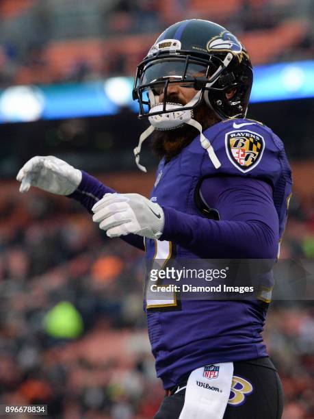 Safety Eric Weddle of the Baltimore Ravens walks off the field after an interception in the endzone by cornerback Brandon Carr in the fourth quarter...