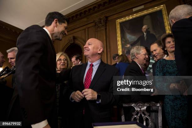 Speaker of the House Paul Ryan, a Republican from Wisconsin, left, speaks with Representative Kevin Brady, a Republican from Texas, during a Tax Cuts...
