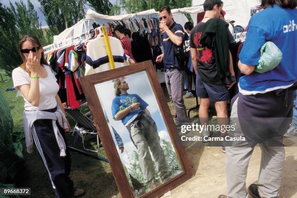 Clothes stand in the FESTIMAD View of people looking and proving the clothes in a position of the market,FESTIMAD music festival , Mostoles, Madrid...