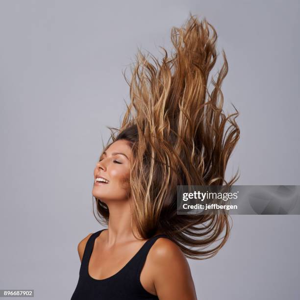 beauty that'll blow your hair back - hair toss stock pictures, royalty-free photos & images