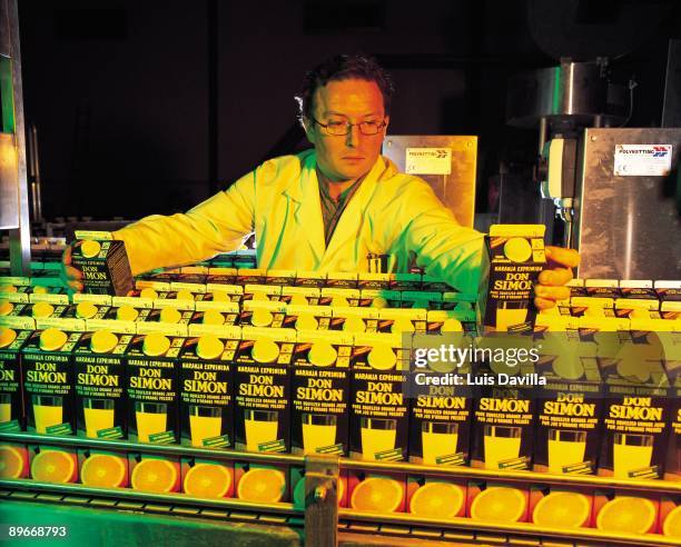 Don Simon juice factory A worker selects the container of tetra-brick