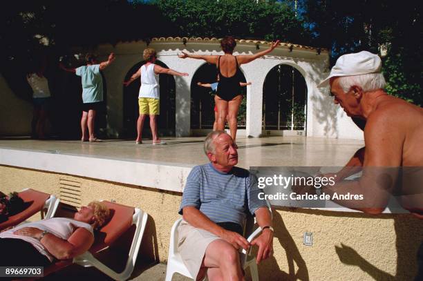 Calpe, Alicante . Pensioners doing exercises in activities of a hotel.