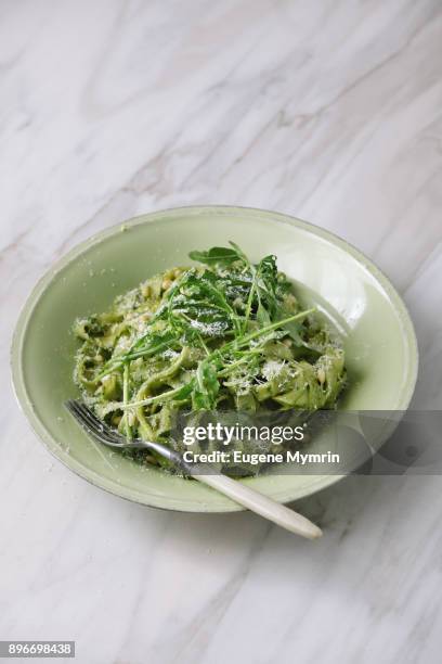 home made tagliatelle with basil and rocket pesto - tagliatelle fotografías e imágenes de stock