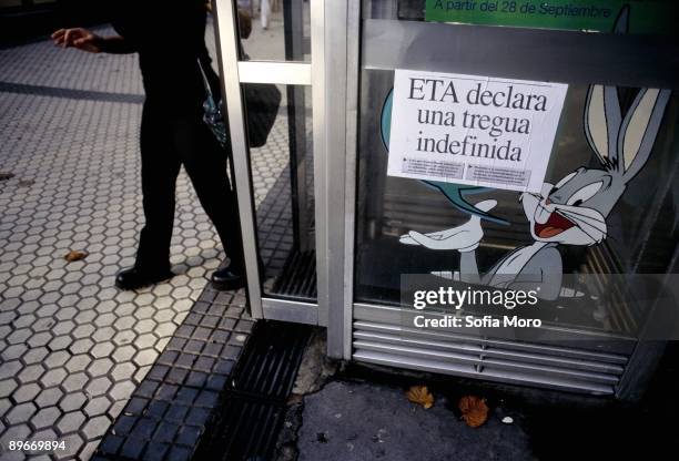 Poster of the truce of ETA. Poster of the truce of ETA in a glass of a phone booth.