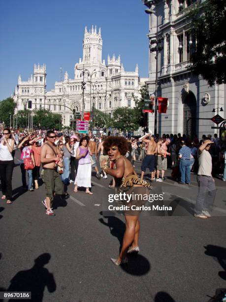 June 30, 2007. Madrid. Spain. Pride Parade celebration. In the photo, a transexual showing the thighs. At the back the Correos building.