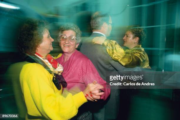 Zaragoza, Spain. Pensioners woman dancing in a friend´s party.