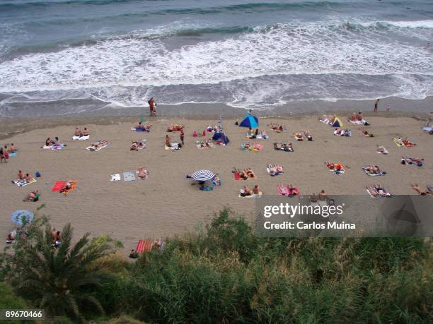 March 20, 2007. Gran Canarias, Canary Islands, Spain. Ingles Beach In the image, turistic area: a group of tourists sunbathing.