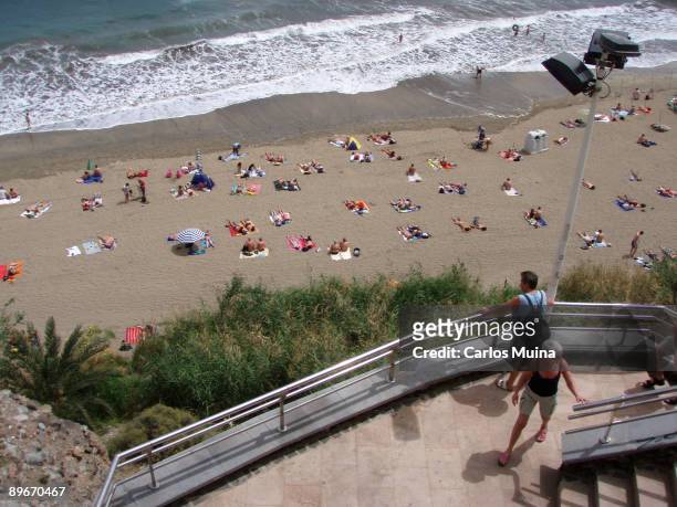 March 20, 2007. Gran Canarias, Canary Islands, Spain. Ingles Beach In the image, turistic area: a group of tourists sunbathing.