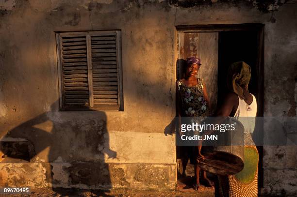 Mozambique. Mozambique Island. Colonial city called "stone and lime city". Women in the street.