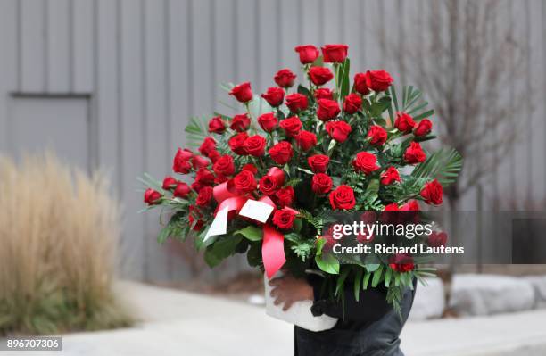 Floral bouquet arrives to the front door. Thousands came out to the International Centre for the memorial for billionaires Honey and Barry Sherman....