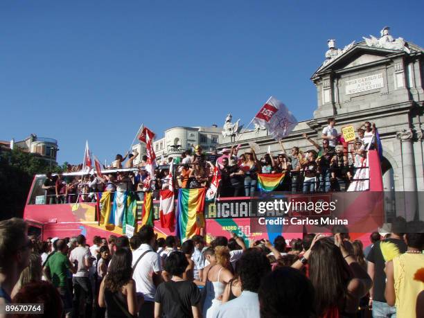 June 30, 2007. Madrid. Spain. Pride Parade celebration. In the photo, the PSOE carriage with flags of some countries. In the back, the Puerta de...