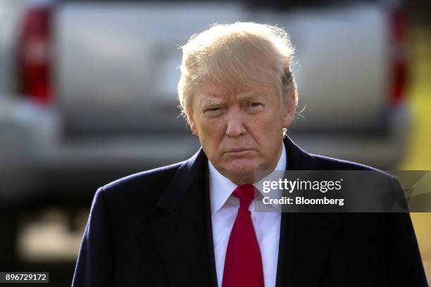 President Donald Trump walks to speak to members of the media before boarding Marine One on the South Lawn of the White House in Washington, D.C.,...