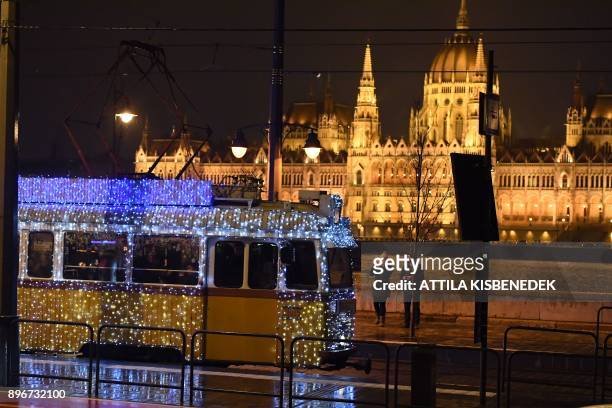 Decorated Christmas light tram is pictured in Budapest on December 21, 2017. The tram is decorated with 40000 LED lights and operates during the...