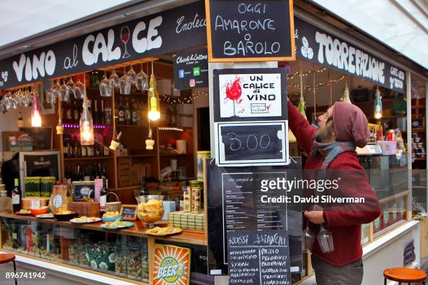 Wine is offered for 3 Euro a glass at the Chicchi e Lettere wine bar and cafe in the Testaccio market on December 11, 2017 in Rome, Italy. Despite...