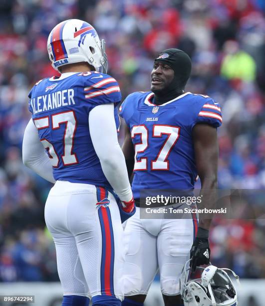 Tre'Davious White of the Buffalo Bills talks to Lorenzo Alexander during a break in the action of their NFL game against the Miami Dolphins at New...