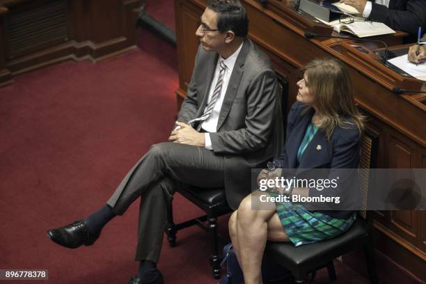 Martin Vizcarra, Peru's vice president, left, and Mercedes Araoz, Peru's second vice president, listen while Pedro Pablo Kuczynski, Peru's president,...