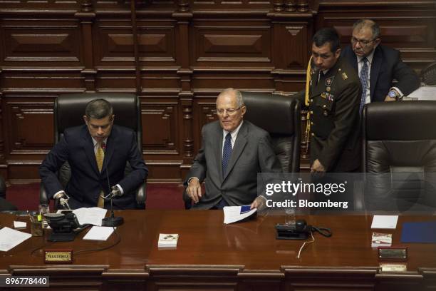 Pedro Pablo Kuczynski, Peru's president, center, prepares to exits after testifying before the National Congress in Lima, Peru, on Thursday, Dec. 21,...