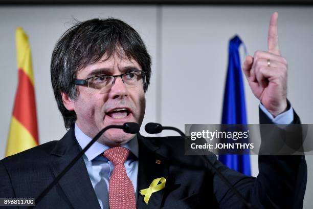 Axed Catalan president Carles Puigdemont delivers a speech after the results of the regional elections in Catalonia at the Square - Brussels Meeting...