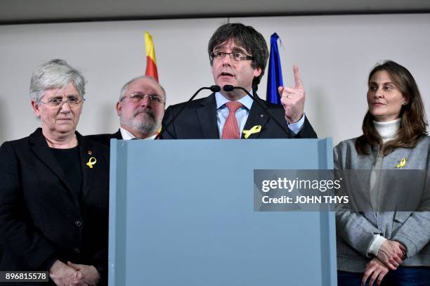 Axed Catalan president Carles Puigdemont, flanked by former Catalan Minister of Agriculture, Livestock, Fisheries and Food Meritxell Serret , former...