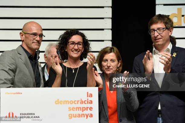 'Esquerra Republicana de Catalunya' - ERC candidates Marta Rovira, Raul Romeva, Carme Forcadell and Carles Mundo applaud after giving a press...