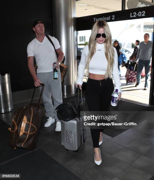 Kroy Biermann and Kim Zolciak are seen at LAX on December 21, 2017 in Los Angeles, California.