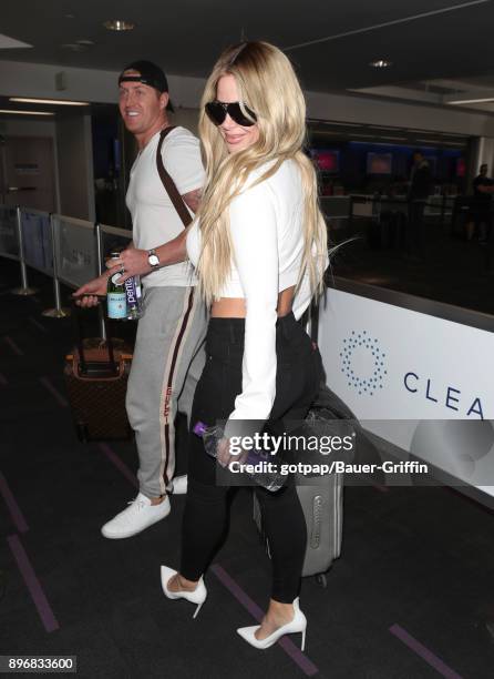 Kroy Biermann and Kim Zolciak are seen at LAX on December 21, 2017 in Los Angeles, California.