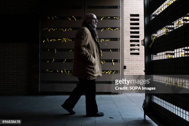 Man seen going out of the school after he casting his vote at the polling station for the Catalonia regional election. Catalan started today to elect...