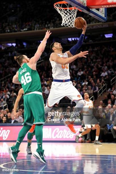 Enes Kanter of the New York Knicks takes a shot against Aron Baynes of the Boston Celtics in the first quarter during their game at Madison Square...