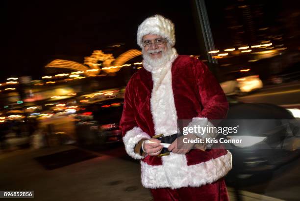 Bob Guzman, who's played Santa" hands out glow sticks during the "Solstice Soul Train" event as part of "Make Music Winter, December 21" on December...