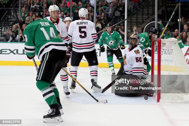 Jamie Benn of the Dallas Stars scores a goal against Corey Crawford of the Chicago Blackhawks in the first period at American Airlines Center on...