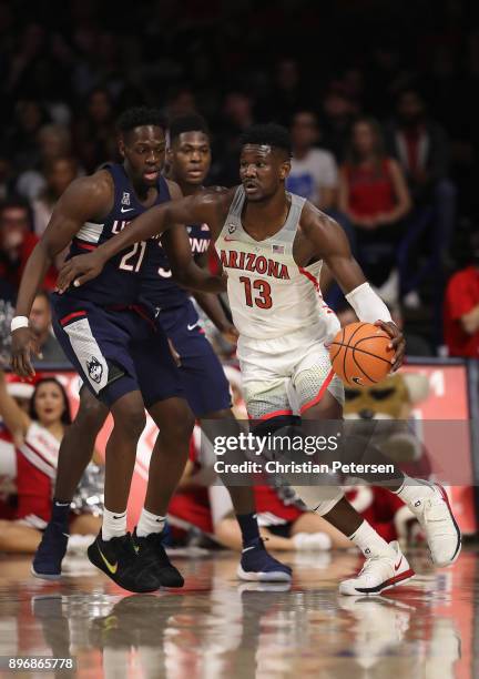 Deandre Ayton of the Arizona Wildcats drives the ball past Mamadou Diarra of the Connecticut Huskies during the second half of the college basketball...