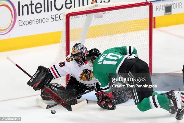 Corey Crawford of the Chicago Blackhawks blocks a shot against Martin Hanzal of the Dallas Stars in the third period at American Airlines Center on...