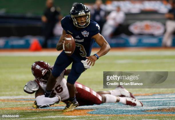 Quarterback Maurice Alexander of the Fiu Golden Panthers is sacked by linebacker Sam Franklin of the Temple Owls during the fourth quarter of the Bad...