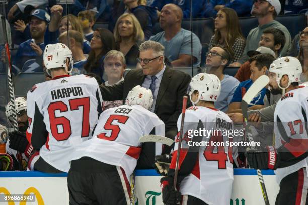 Ottawa Senators associate coach Marc Crawford gives instruction during the overtime period of an NHL game between the Ottawa Senators and the Tampa...