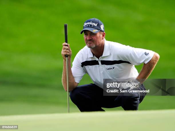 Jerry Kelly looks over a shot on the ninth hole during the second round of the WGC-Bridgestone Invitational on the South Course at Firestone Country...