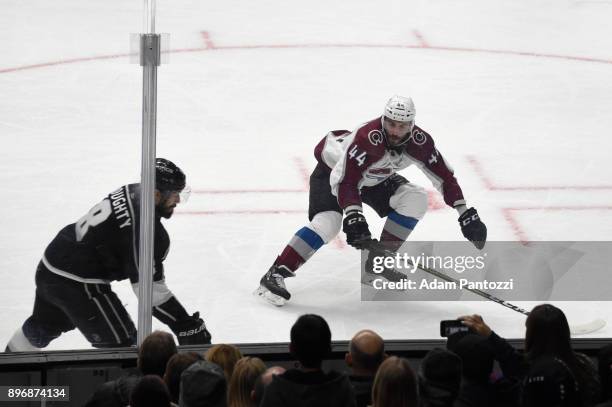 Mark Barberio of the Colorado Avalanche plays defense against Drew Doughty of the Los Angeles Kings at STAPLES Center on December 21, 2017 in Los...
