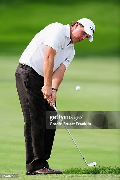 Phil Mickelson of USA plays his chip shot on the 14th hole during the second round of the World Golf Championship Bridgestone Invitational on August...