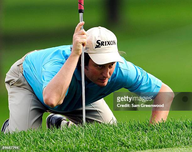 Tim Clark of South Africa plays a shot on the ninth hole during the second round of the WGC-Bridgestone Invitational on the South Course at Firestone...
