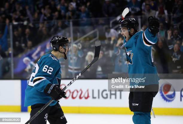 Kevin Labanc and Tomas Hertl of the San Jose Sharks celebrate after Labanc scored the game-winning goal in overtime against the Vancouver Canucks at...