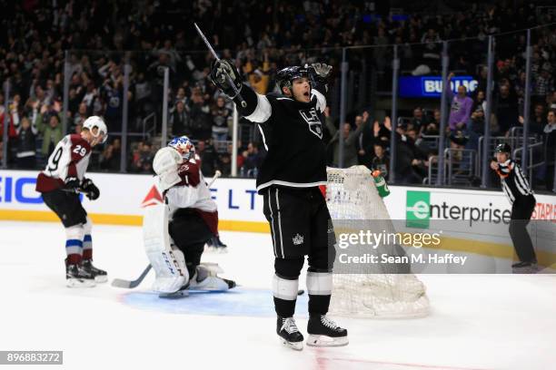 Semyon Varlamov and Nathan MacKinnon of the Colorado Avalanche look on after Dustin Brown of the Los Angeles Kings scores the winning goal in...