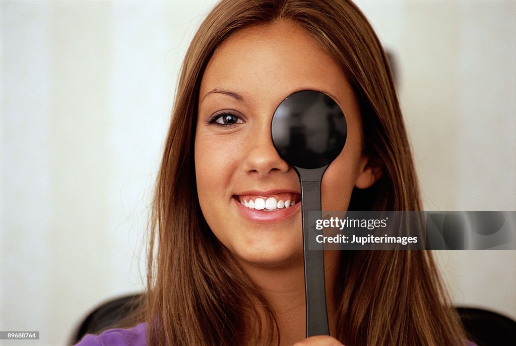 A woman taking an eye exam