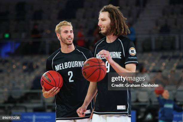 Felix Von Hofe and Craig Moller of Melbourne United share a joke during warm up prior to the round 11 NBL match between Melbourne United and the...