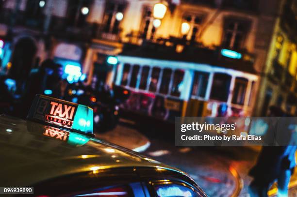 portuguese taxi and streetcar - taxi imagens e fotografias de stock