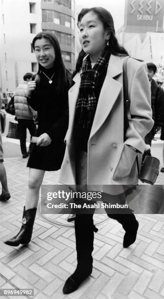 Women walk on the street on February15, 1992 in Tokyo, Japan.