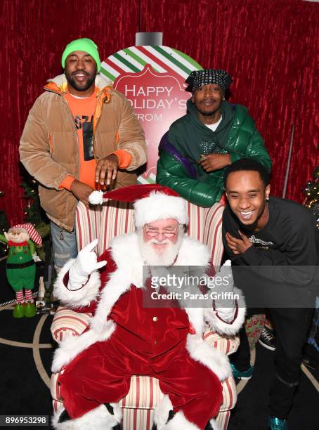 Mike Will Made It, Eearz, and Slim Jxmmi pose with Santa Claus at 2nd Annual Mike WiLL's Wish Fest at Andretti Indoor Karting and Games Marietta on...