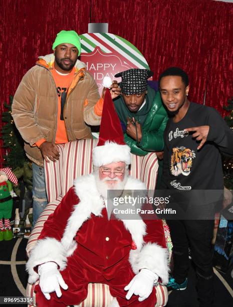 Mike Will Made It, Eearz, and Slim Jxmmi pose with Santa Claus at 2nd Annual Mike WiLL's Wish Fest at Andretti Indoor Karting and Games Marietta on...