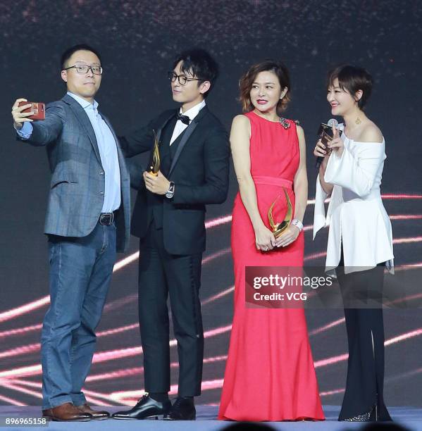 Actress Rosamund Kwan poses with trophy for a photo during the 2017 Donews Award Ceremony on December 21, 2017 in Beijing, China.