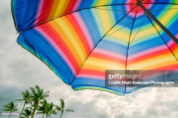 kukio beach umbrella #3 - castaway island stock-fotos und bilder