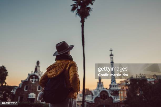 tourist enjoying park guell - winter barcelona stock pictures, royalty-free photos & images